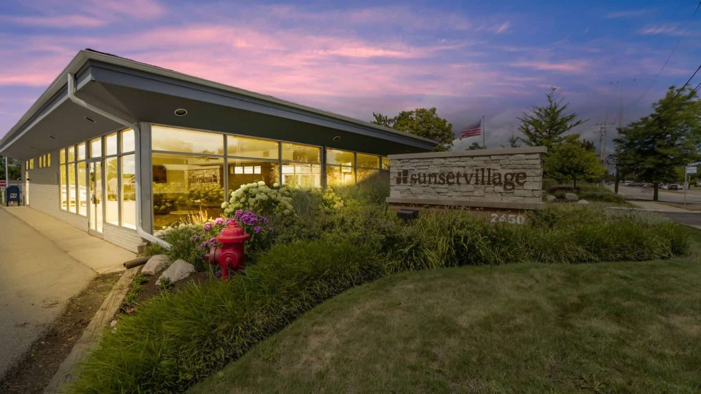 image of sunset village sign during sunset